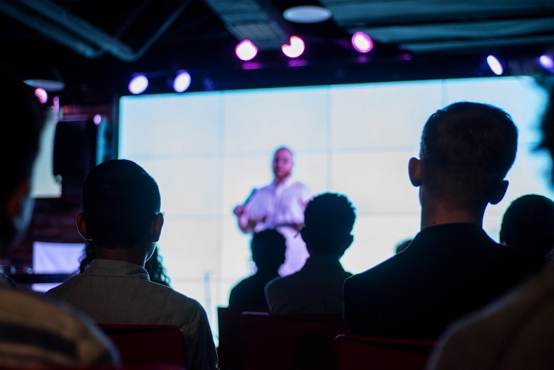 Corporate annual conference with presenter and business audience